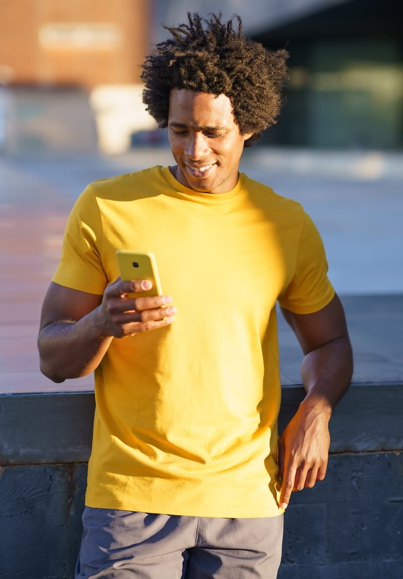 black-man-consulting-his-smartphone-while-resting-2026-01-09-09-24-01-utc (1)